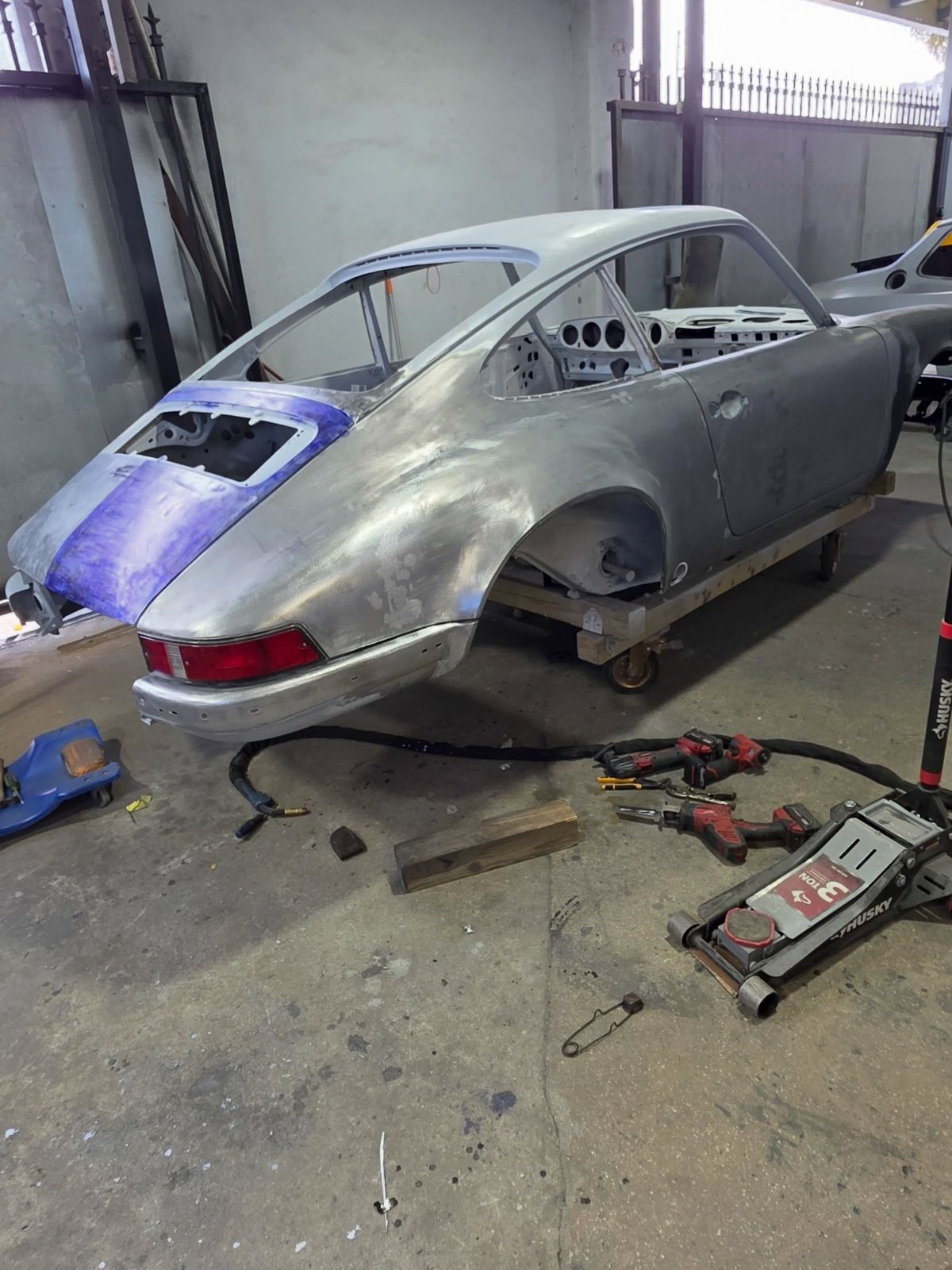 Classic car body stripped to bare metal in the shop